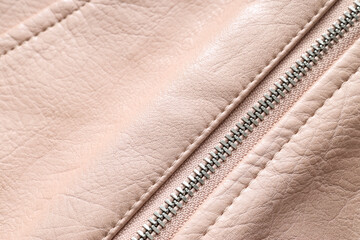 Fashion design and textile industry, close up of a metal zipper on a soft pink faux leather jacket for clothing manufacturing and apparel retail © Pixel-Shot