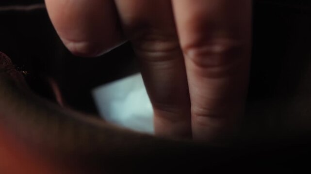 Close up of a hand taking a condom from a pocket inside a handbag for personal protection and safe sex. High quality 4k footage