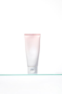 Feminine skincare container. This clean beauty mockup conveys purity and softness, perfect for promoting face wash, hand cream, or body lotion with a gentle, hydrating focus.