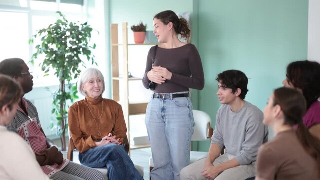 Female psychologist conducts brainstorming session among colleagues at a round table . High quality 4k footage