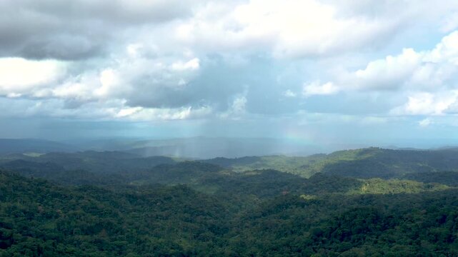 Rainforest hills under shifting storm clouds in Oriente, Ecuador