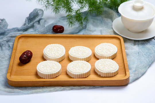White Steamed Rice Cakes On Floral Plate With Bamboo Tea Tray