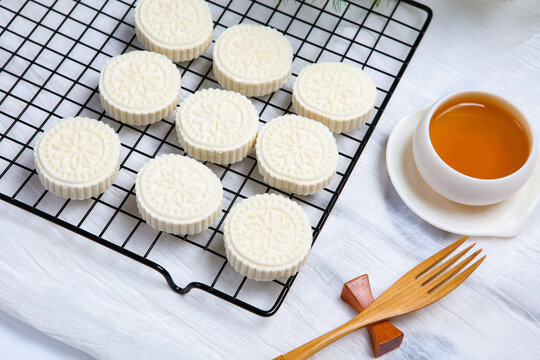 White Steamed Rice Cakes On Floral Plate With Bamboo Tea Tray