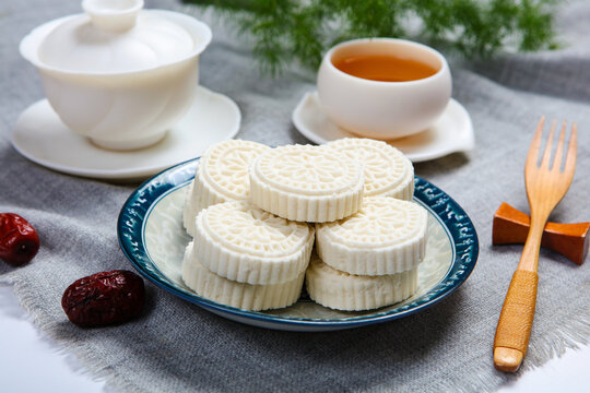 White Steamed Rice Cakes On Floral Plate With Bamboo Tea Tray