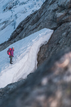 Mountaineer Standing Near Snow Cornice on Tantalus Ridge