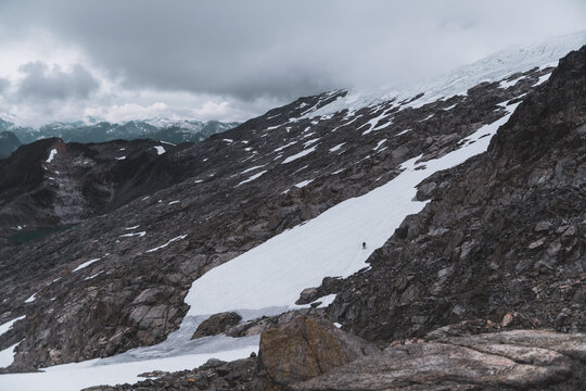 Solo Mountaineer Trekking Across Snowy Glacier in Tantalus Range