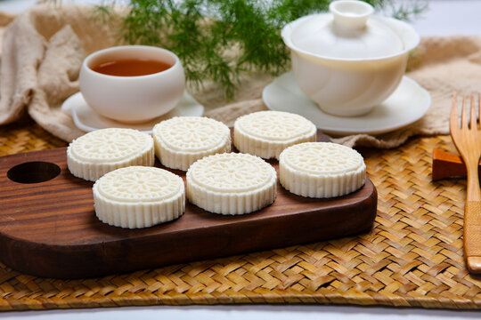 White Steamed Rice Cakes On Floral Plate With Bamboo Tea Tray