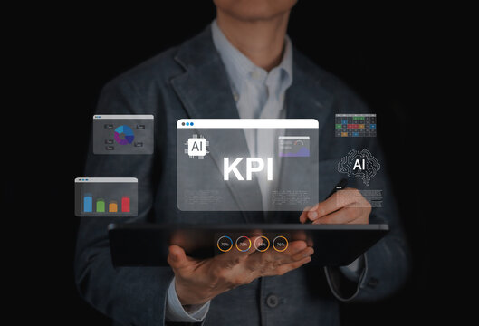 Businessman using tablet with AI and KPI hologram overlays. Artificial intelligence in business data analytics, performance tracking, financial chart analysis, and future technology concept.