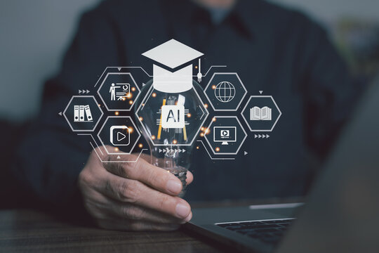 Close up hand holding a glowing light bulb with AI education hologram overlay. Concept of artificial intelligence in e-learning, smart online education, and digital technology in university.