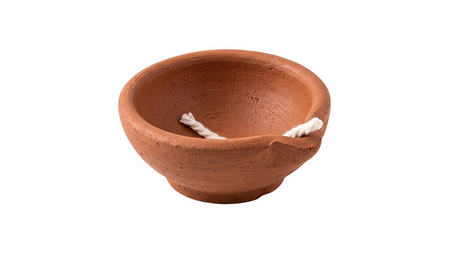 Traditional terracotta clay diya oil lamp with cotton wick, handmade terracotta oil diya for diwali celebration and puja ritual isolated PNG with Transparent Background
