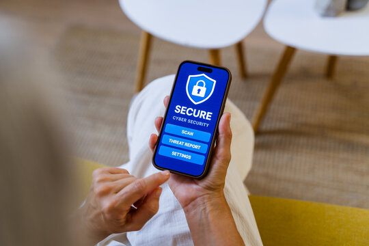 White person using cyber security app on smartphone indoors