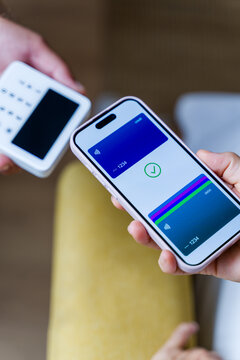 Smartphone completing contactless payment with terminal