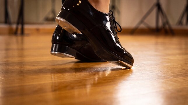 Low Close Up of Tap Dancing Shoes Striking Wooden Floor