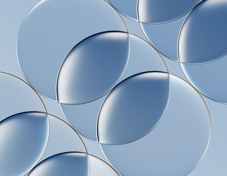 Abstract 3d rendering of overlapping clear glass circles in blue