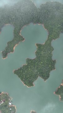 Guatap&eacute; Featuring El Pe&ntilde;&oacute;n de Guatap&eacute; Monolith and Scenic Reservoir Landscape in Antioquia, Colombia. Establishing Shot. Aerial View. Vertical Video.