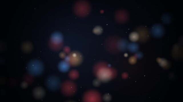 Abstract colorful bokeh particles drifting on dark background creating cinematic ambiance.