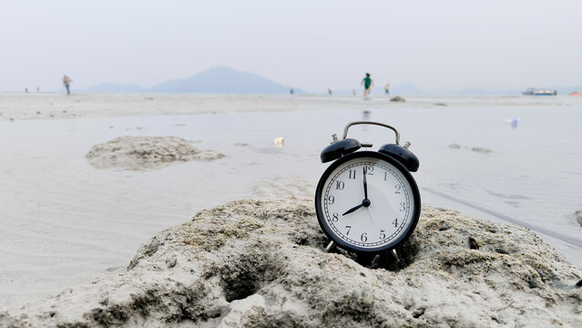 Alarm Clock at Eight O'Clock on Low Tide Beach for Time Banner D