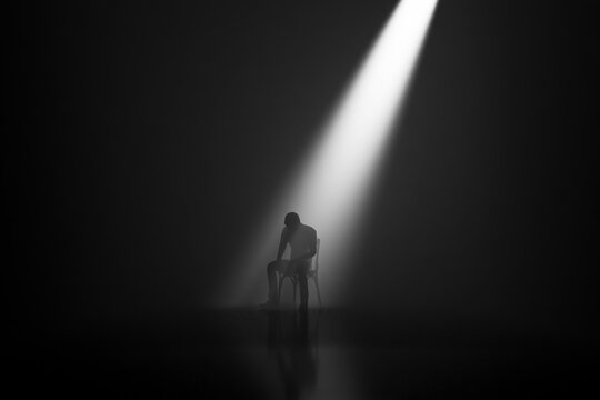 Solitary worker seated under a narrow spotlight in a dark liminal room 3D