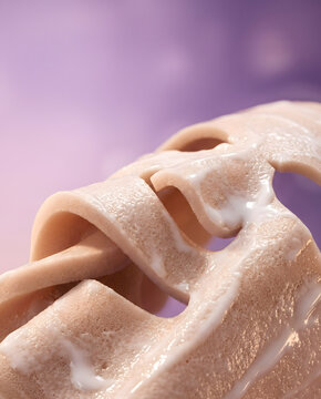 Macro close up of thick porous microfiber facial sheet mask texture soaked in milky white cosmetic serum