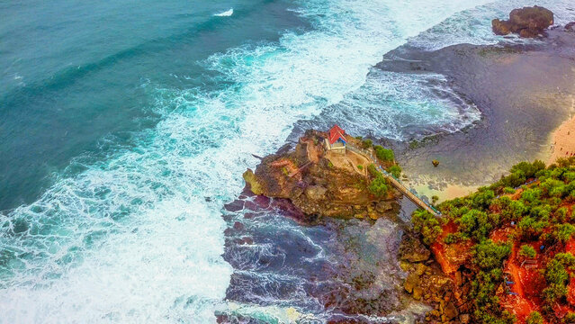 Aerial view of Kukup Beach Nature Inn featuring lush coastal vegetation, sandy shores, and turquoise ocean waters in Kecamatan Tanjungsari, Daerah Istimewa Yogya, Indonesia.