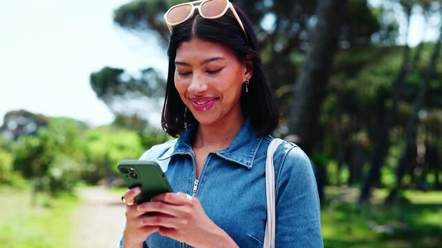 Text, laugh or university student in park with phone, online chat or funny post on social media app. Digital, typing or happy woman outdoor with tech, college meme or comic reaction on gen z blog.