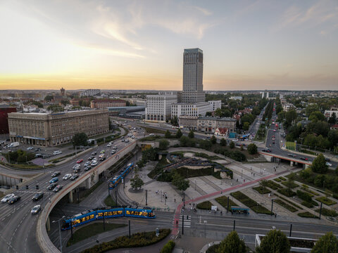 Aerial view of the Unity Centre skyscraper surrounded by urban traffic, a tram line, and city streets in Krakow, Lesser Poland Voivode, Poland.