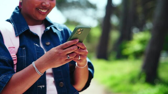 Text, hands or university student on campus with phone, online chat or funny post on social media. Digital, laugh or happy woman outdoor with tech, college meme or comic reaction on gen z blog.
