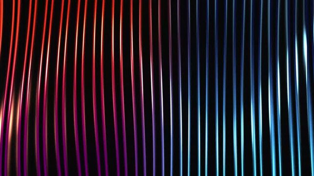 Close up of metallic fluted surface with blue and red gradients