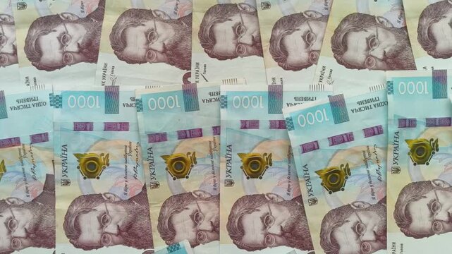 Ukrainian hryvnia 1000 banknotes background video, cash money finance concept. Close up of Ukrainian hryvnia currency bills, UAH 1000 bank notes video footage. National currency stock footage