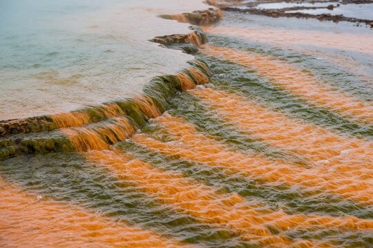 Water flowing over a rocky ledge