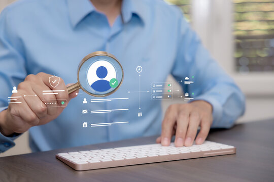 Digital identity verification concept with a magnifying glass over an approved user profile, password validation and access permissions on a virtual interface.