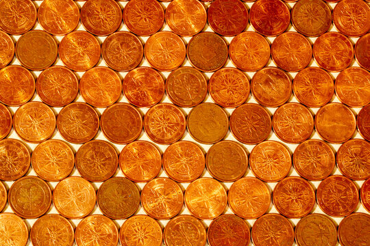Sepia-toned background pattern of two-cent coins