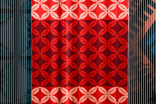 A display of traditional Indonesian fabric named batik with colorful patterns.