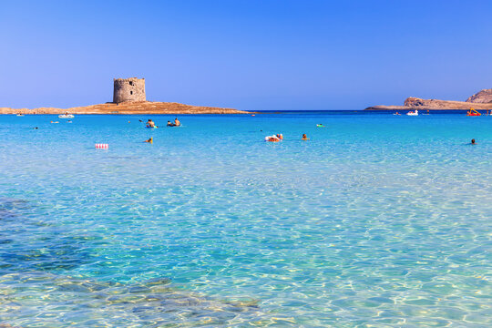 Sardinia, Italy. La Pelosa Beach with its turquoise lagoon and crystal-clear waters near Stintino.