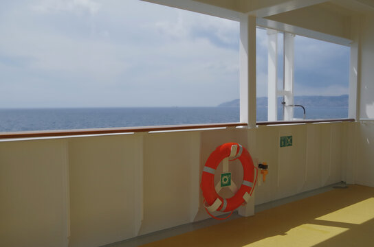 Deck chairs or sun loungers with table on balcony terrace patio promenade boat deck of classic luxury cruise ship cruiseship ocean liner with amazing oceanview