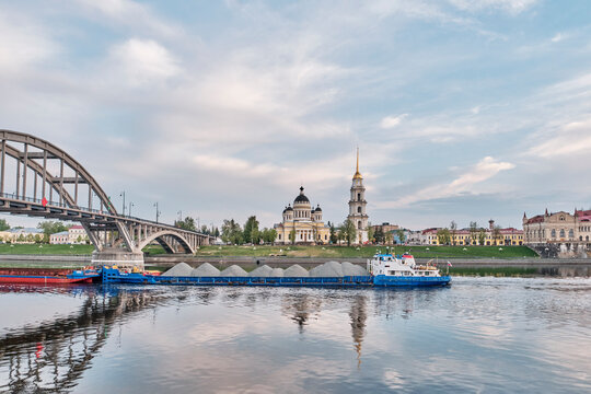 Panoramic view of Rybinsk embankment with Transfiguration Cathedral and bridge over Volga river, Russia