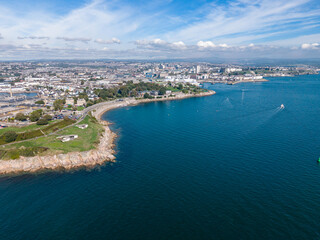 Fototapeta premium Aerial view of Devils Point estuary, Plymouth coastline and boats in blue water