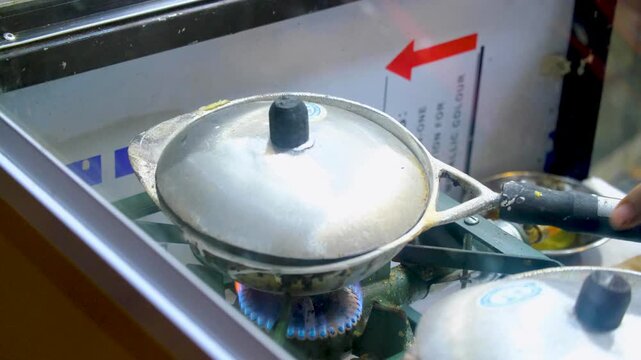 Sri Lankan hoppers appa food being cooked at street vendor restaurant in Sri Lanka