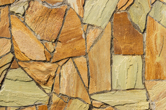stone wall of different colors as background.