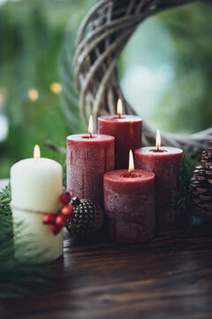 Candle decoration for christmas and advent as a symbol of faith. Vertical background for religious holidays with space for text.