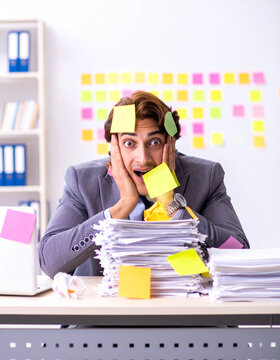 Overwhelmed Businessman with Sticky Notes and Paper Stacks