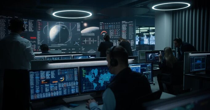 Monitoring Control Room. Spaceflight Operators Study Lunar Maps, Trajectory Diagrams and Live Spacecraft Metrics on Panoramic Dashboards, Supervising Orbital Navigation and Critical Mission Systems.