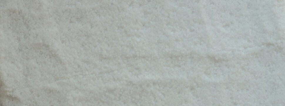 Top View Of White Granulated Salt Or Sugar Texture Background
