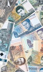 Big amount of Cambodian riel money banknotes. Cambodia cash bills of KHR currency close up © Marharyta