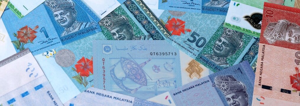 Big amount of Malaysian ringgit money banknotes. Malaysia cash bills of MYR currency close up