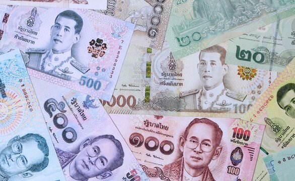 Big amount of Thai baht money banknotes. Thailand cash bills of THB currency close up