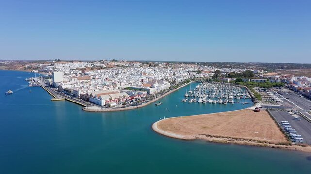 Beautiful aerial panoramic view of ayamonte, a charming town located on the banks of the guadiana river in andalusia, spain, featuring its marina filled with boats on a sunny day