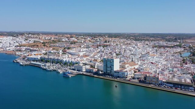 Beautiful aerial view of the spanish town of ayamonte, a city in the province of huelva, andalusia, located on the left bank of the guadiana river, on a sunny day with a clear blue sky