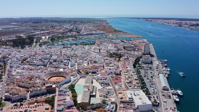 High altitude view showing the city of ayamonte, a traditional spanish town with its bullring, marina, and port along the guadiana river, which marks the border between spain and portugal