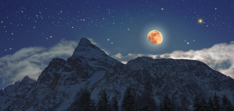 Full moon and abstract stars sky in a winter mountains.